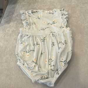 Angle Dear Brand romper in light green with pretty flowers.